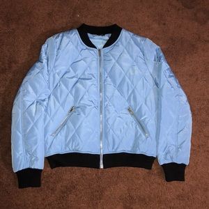Blue puffer jacket with black trimming